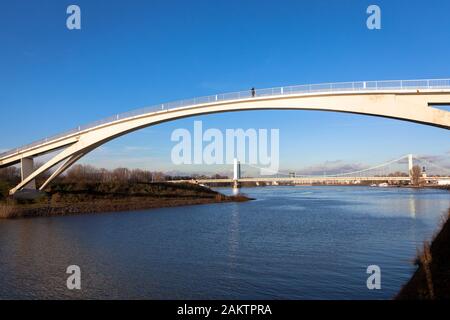 the bridge in the Rhine harbor in the district Muelheim, in the background the Muelheimer bridge over the Rhine, Cologne, Germany.  die Katzenbuckelbr Stock Photo