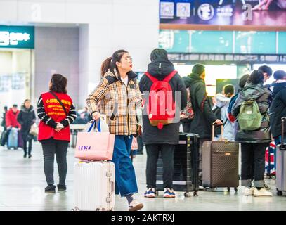 Chinese passengers crowd the terminal at the North Shenyang Railway Station before boarding trains to go back home for the upcoming Chinese New Year d Stock Photo