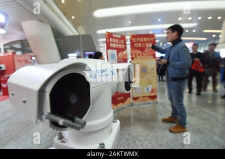 A police robot powered by the 5G wireless service of China Mobile patrols the East Hangzhou Railway Station during the annual Spring Festival travel r Stock Photo