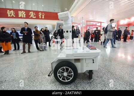 A police robot powered by the 5G wireless service of China Mobile patrols the East Hangzhou Railway Station during the annual Spring Festival travel r Stock Photo