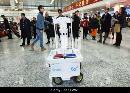 A police robot powered by the 5G wireless service of China Mobile patrols the East Hangzhou Railway Station during the annual Spring Festival travel r Stock Photo