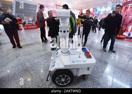 A police robot powered by the 5G wireless service of China Mobile patrols the East Hangzhou Railway Station during the annual Spring Festival travel r Stock Photo