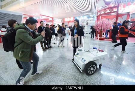 A police robot powered by the 5G wireless service of China Mobile patrols the East Hangzhou Railway Station during the annual Spring Festival travel r Stock Photo