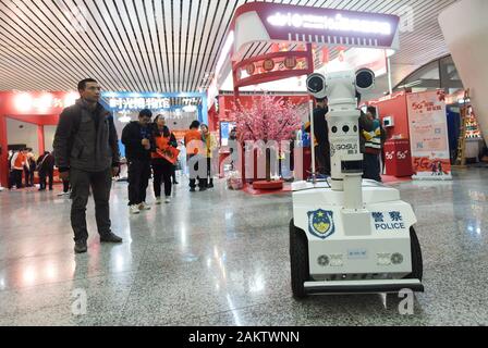 A police robot powered by the 5G wireless service of China Mobile patrols the East Hangzhou Railway Station during the annual Spring Festival travel r Stock Photo