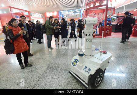 A police robot powered by the 5G wireless service of China Mobile patrols the East Hangzhou Railway Station during the annual Spring Festival travel r Stock Photo