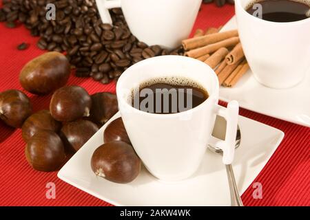 Coffee cup and beans on a red placemat Stock Photo