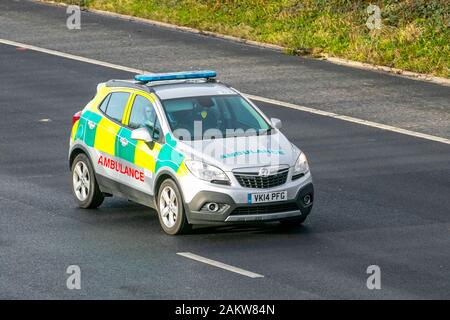 2014, Vauxhall Mokka Exclusive CDTI S/S 4; NHS Emergency Ambulance responder; UK Vehicular traffic, transport, modern vehicles, saloon cars, vehicles, vehicle, uk roads, motors, motoring south-bound on the 3 lane M61 motorway highway Stock Photo