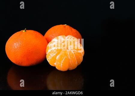 Tangerines isolated on black background. Copy space. Stock Photo