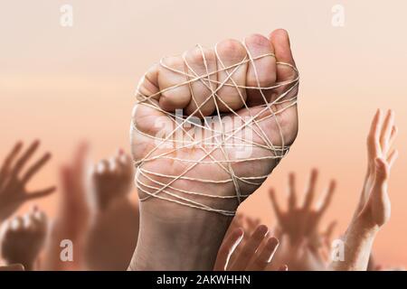 Man Hand Tied With Wire In Crowd Stock Photo
