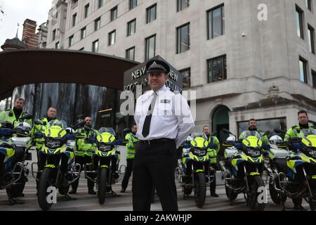 Chief inspector Jim Corbett and other police officers from the Metropolitan Police stand behind the new motorbikes that have been purchased for their task force at New Scotland Yard, London. Stock Photo