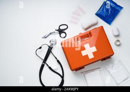 First Aid Kit With Medical Equipment On White Background Stock Photo