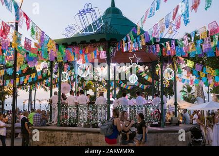 Mexico, Puerto Vallarta, Jalisco, bandstand decorated for a festival with band and people Stock Photo