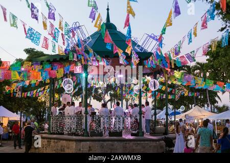 Mexico, Puerto Vallarta, Jalisco, bandstand decorated for a festival with band and people Stock Photo