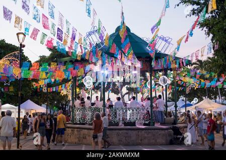 Mexico, Puerto Vallarta, Jalisco, bandstand decorated for a festival with band and people Stock Photo