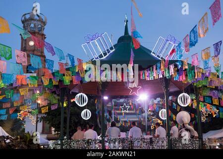 Mexico, Puerto Vallarta, Jalisco, bandstand decorated for a festival with band and people Stock Photo