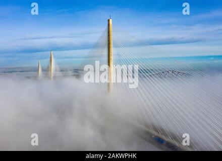 South Queensferry, Scotland, UK. 10th Jan 2020. Drone image of a spectacular cloud inversion at Queensferry Crossing Bridge with the lower half of the bridge shrouded in fog but the upper half in beautiful sunny weather. Iain Masterton/Alamy Live News Stock Photo