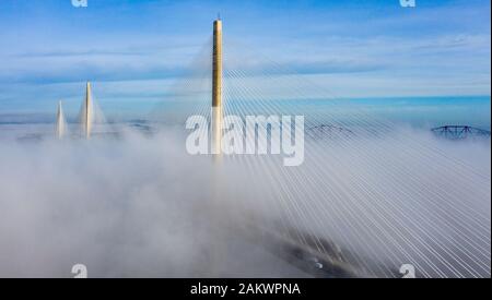 South Queensferry, Scotland, UK. 10th Jan 2020. Drone image of a spectacular cloud inversion at Queensferry Crossing Bridge with the lower half of the bridge shrouded in fog but the upper half in beautiful sunny weather. Iain Masterton/Alamy Live News