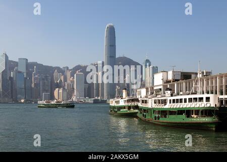 Hong Kong Star Ferry - three star ferries in Hong Kong Harbour at the Star Ferry pier, on a sunny day in November, Hong Kong Asia Stock Photo