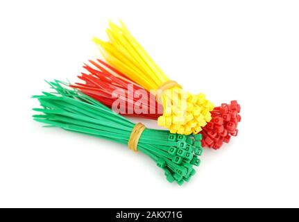 Different colors of plastic nylon cable ties closeup on white background Stock Photo