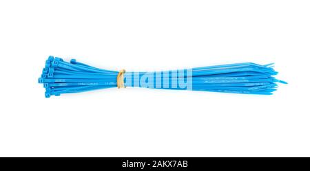 blue plastic nylon cable ties closeup on white background Stock Photo
