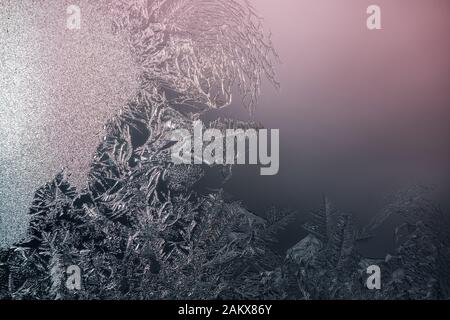 Natural ice crystals frostwork on the window, space for text. Macro shoot with shallow depth of field. Window Ferns and Frost Flowers. Stock Photo