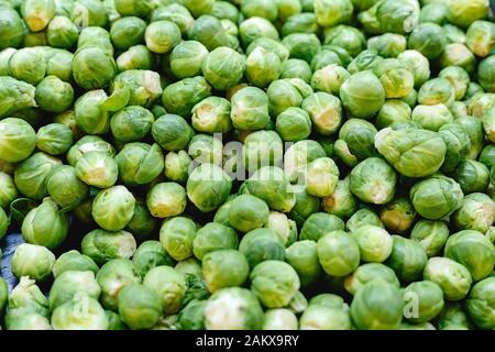 Fresh raw organic uncooked Brussels sprouts vegetables for sale at farmers market. Vegan food and healthy nutrition concept. Top view stock photo Stock Photo