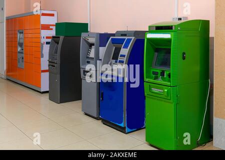 A line of multi-colored ATM in a shopping center. Stock Photo