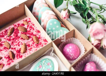 Gift set with hand made sweets in a box on a white table. Stock Photo