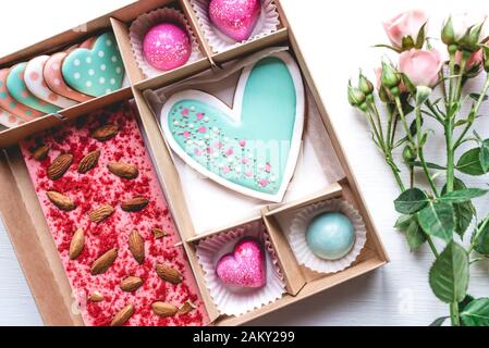 Gift set with hand made sweets in a box on a white table. Stock Photo