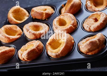 close-up of classic Yorkshire puddings in baking tray on a concrete table, english cuisine, view from above Stock Photo