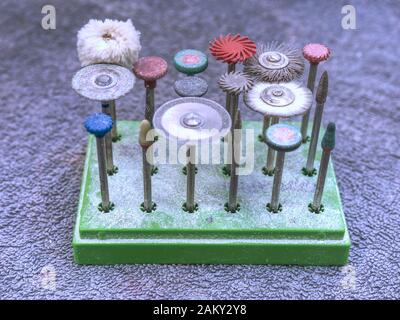 Dental tools for milling, cutting or polishing by dental carbide burs.  Professional equipment for production of dental implant or all-ceramic crown w Stock Photo
