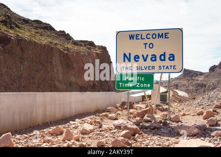 Boulder City, Nevada, USA- 01 June 2015: Large sign informing about the Nevada state border and the Pacific Time Zone. Near Hoover Dam. Stock Photo