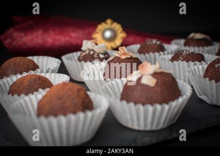 home made cake chocolate potatoes on black board Stock Photo