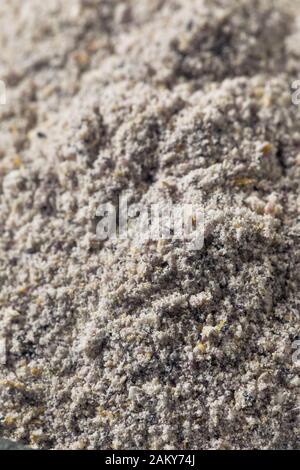 Raw Blue Organic Cornmeal Flour in a Bowl Stock Photo