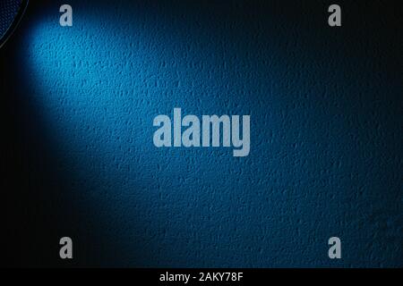 Blue ray of light on textural background Stock Photo