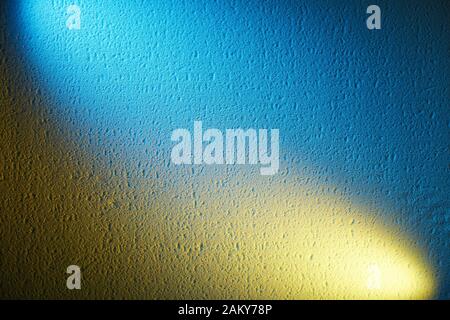 Light yellow and blue lights on a textural background Stock Photo