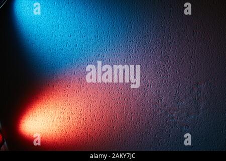 Red and blue ray of light on the textural background Stock Photo