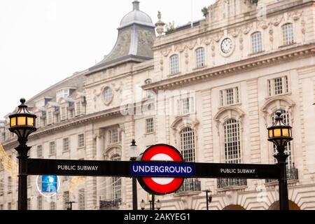 LONDON, UK - December 31, 2019: Piccadilly circus underground exit with buildings in the background Stock Photo