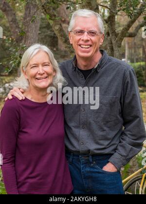 Outdoor portrait of adult senior married couple Stock Photo