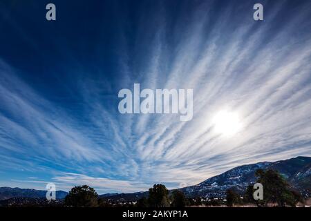 Unusual cloud formations against clear cobalt blue sky; central Colorado; USA Stock Photo