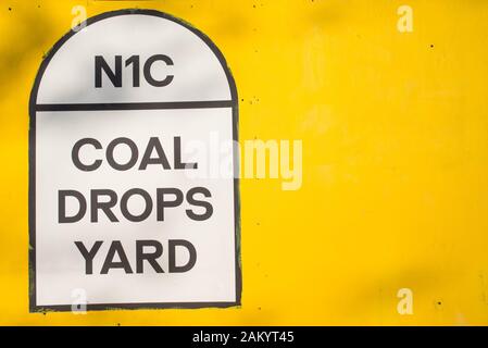 N1C, Coal Drops Yard sign on yellow background. Coal Drops Yard is a unique new shopping quarter at King's Cross, London, UK Stock Photo