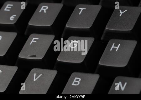 Close-up view of a comuter keyboard with focus on G. Stock Photo
