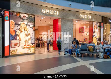 Airport travel, airport terminal shopping, Gucci store at the departure lounge of Rome Fiumicino Airport, Rome, Italy Stock Photo