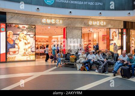 Airport travel, airport terminal shopping, Gucci store at the departure lounge of Rome Fiumicino Airport, Rome, Italy Stock Photo