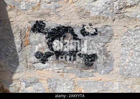 Skull and crossbones graffiti on a stone wall in Eivissa (Ibiza Old Town), Ibiza, Balearic Islands Stock Photo