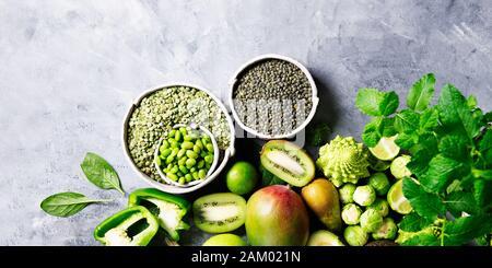 Variety of Green Vegetables and Fruits on the grey background, banner size Stock Photo