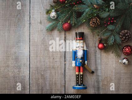 Christmas greenery and decorations against a rustic wood backdrop Stock  Photo - Alamy