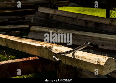 Carpenters scraper on a wooden pole waiting to be used. Stock Photo