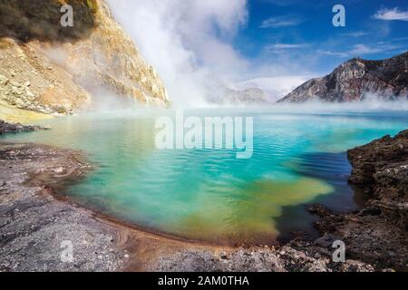 Ijen Lake inside the crater of Kawah Ijen volcano in East Java, Indonesia. Stock Photo