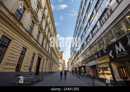 BRNO, CZECHIA - NOVEMBER 5, 2019: Crowd of people walking in a pedestrian street of Brno, Postovska Ulice, in the afternoon surrounded by shops and bo Stock Photo